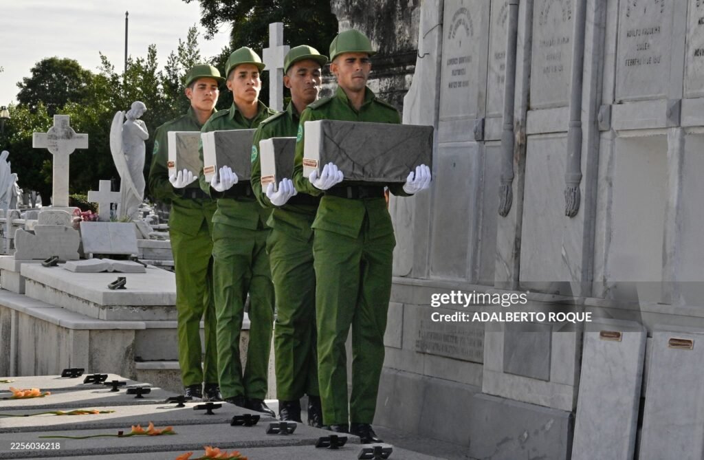Cuban soldiers carry the remains of some of the 32 Cuban soldiers killed during the US incursion in Venezuela during their funeral at Colon cemetery in Havana on January 16, 2026. The capture by US forces of Venezuelan leader Nicolas Maduro on January 3, 2026, and the killing in the operation of 32 Cubans assigned to protect him represent a major blow for the island's revered intelligence services, experts say. 
