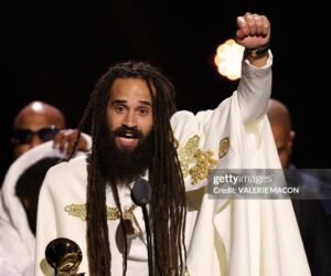 Jamaican musician Keznamdi accepts the Grammy for Best Reggae Album for "BLXXD & FYAH" on stage during the 68th Annual Grammy Awards Premiere Ceremony at the Crypto.com Arena in Los Angeles on February 1, 2026.