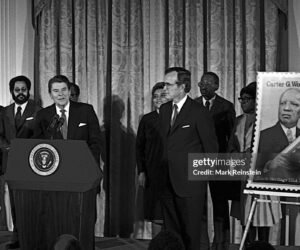 FLASHBACK - Late Republican President Ronald Reagan unveils postage stamp of Carter Woodson (father of black history) at a White House Ceremony marking the observance of National Afro-American (Black) History Month, Washington DC, February 2, 1984.