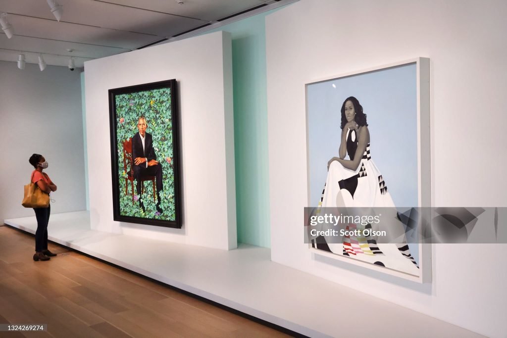A Painting Made For The Dominican Republic Just Got Ripped Off Its Embassy Wall For Being "Too Woke" 24 Visitors view the official portraits of former president Barack Obama by artist Kehinde Wiley and former first lady Michelle Obama by Amy Sherald at The Art Institute of Chicago on June 18, 2021, in Chicago, Illinois. Chicago is the first stop of the Obama Portraits Tour, organized by the Smithsonian’s National Portrait Gallery and running from June 2021 through May 2022. Other scheduled stops on the tour include New York, Los Angeles, Atlanta, and Houston.